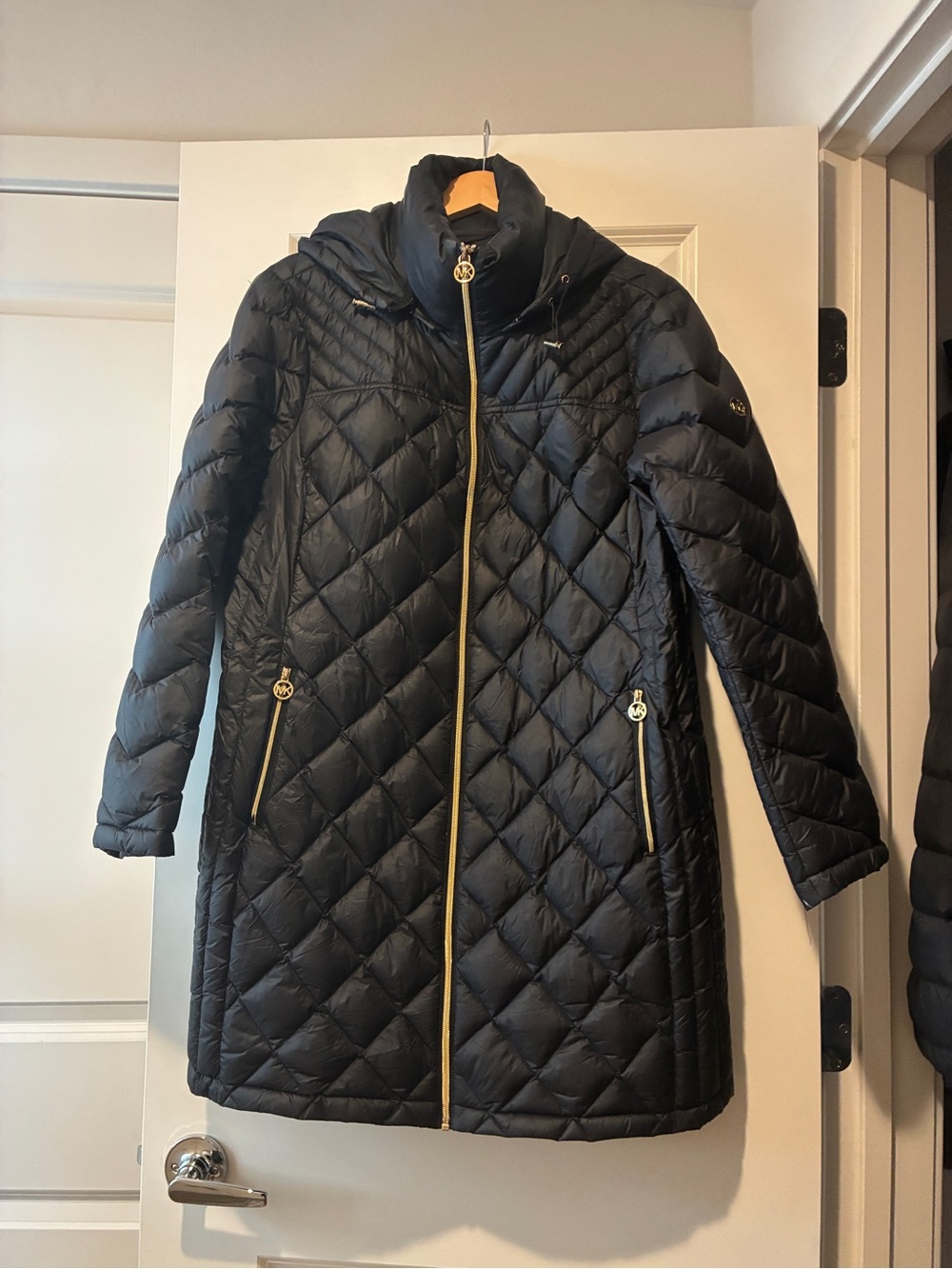 Michael Kors down filled black knee length coat.